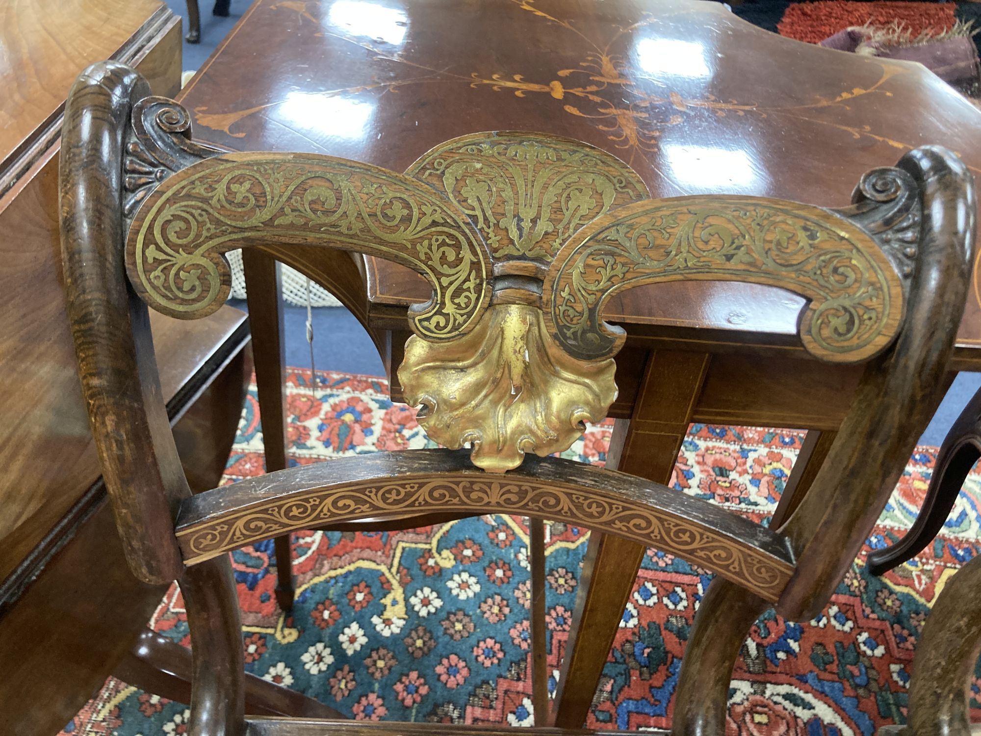 A pair of Regency beech simulated rosewood brass inlaid dining chairs, with pink upholstered seats